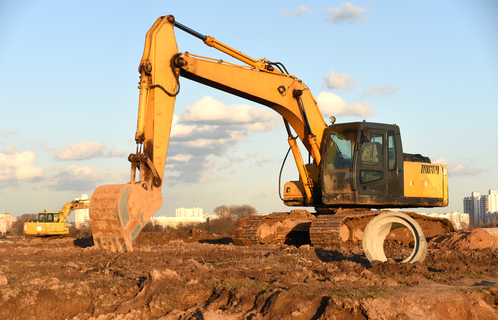 Excavator,Dig,The,Trenches,At,A,Construction,Site.,Trench,For